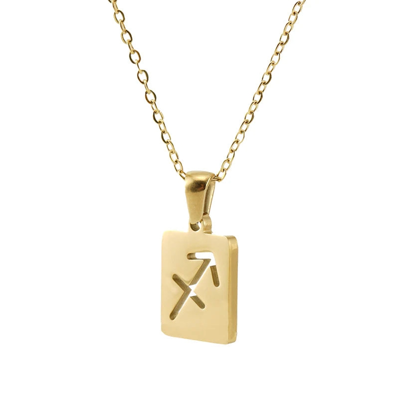 A gold necklace with a dainty chain and rectangular pendant in the Sagittarius style. 