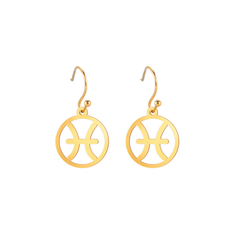 Gold earrings with the astrological symbol for Pisces. The zodiac earrings are suspended in the air with a white background.