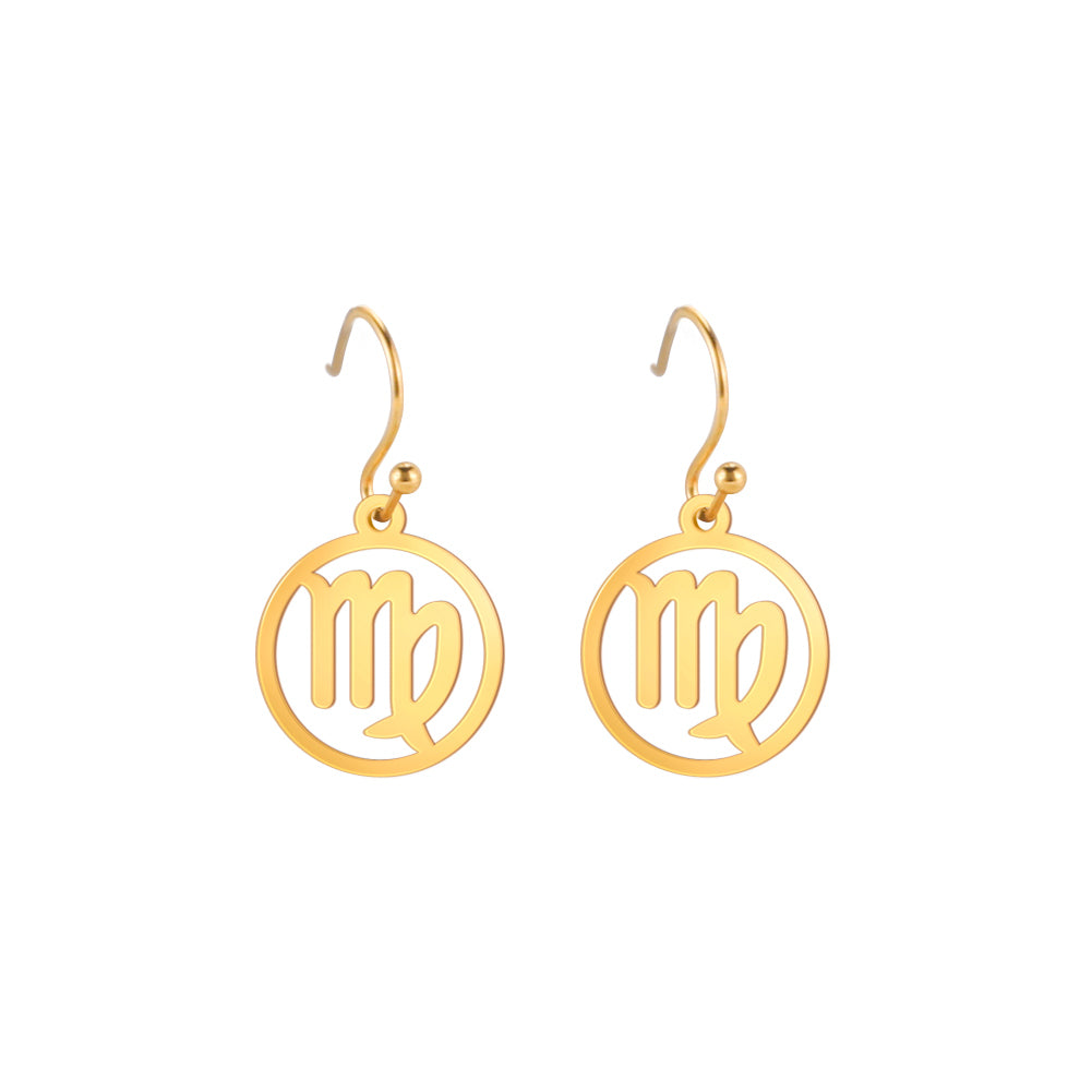 0Gold earrings with the astrological symbol for Virgo. The zodiac earrings are suspended in the air with a white background.